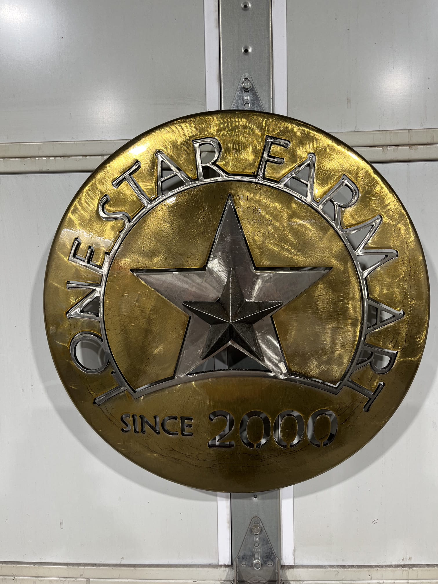 Metal sign with Lone Star Farm Art on it.